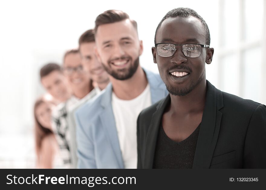 Diverse group of people standing in row. Isolated on white. Diverse group of people standing in row. Isolated on white