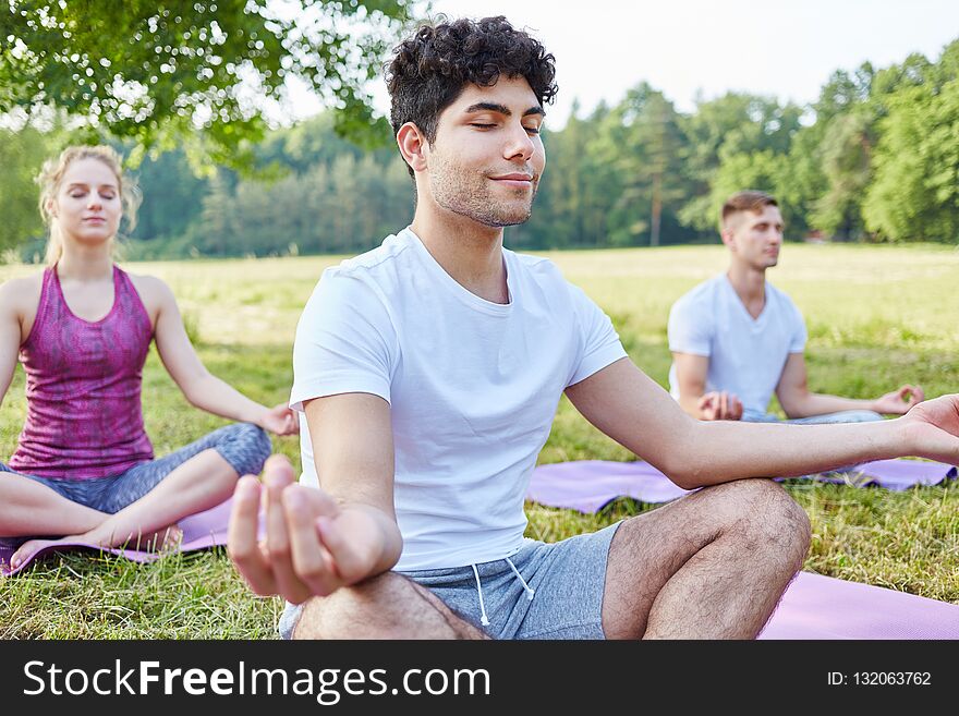 Man practicing yoga and meditating