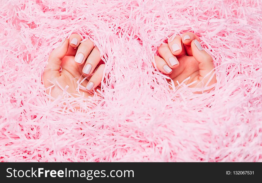 Beautiful woman manicure on creative trendy pink background. Minimalist manicure trend. Top view, flat lay. Beautiful woman manicure on creative trendy pink background. Minimalist manicure trend. Top view, flat lay