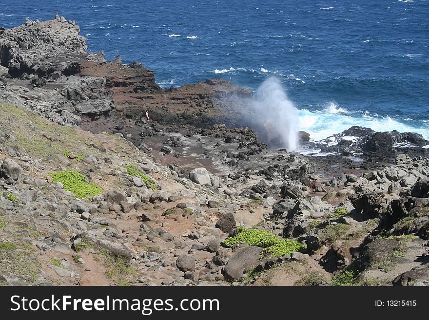 The Nakalele blowhole shoots water from a Pacific Ocean wave on the northwest coast of the tropical island of Maui, Hawaii. The Nakalele blowhole shoots water from a Pacific Ocean wave on the northwest coast of the tropical island of Maui, Hawaii.