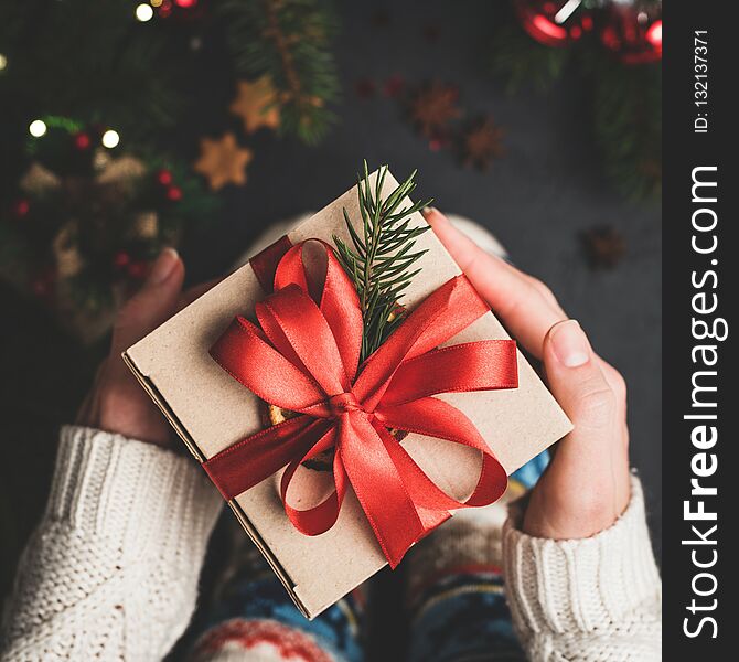 Christmas Gift Box With Red Lace In Hands