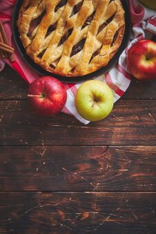 Homemade Pastry Apple Pie With Bakery Products On Dark Wooden Kitchen Table Stock Photography Homemade Pastry Apple Pie With Bakery Products On Dark Wooden Kitchen Table Stock Photography