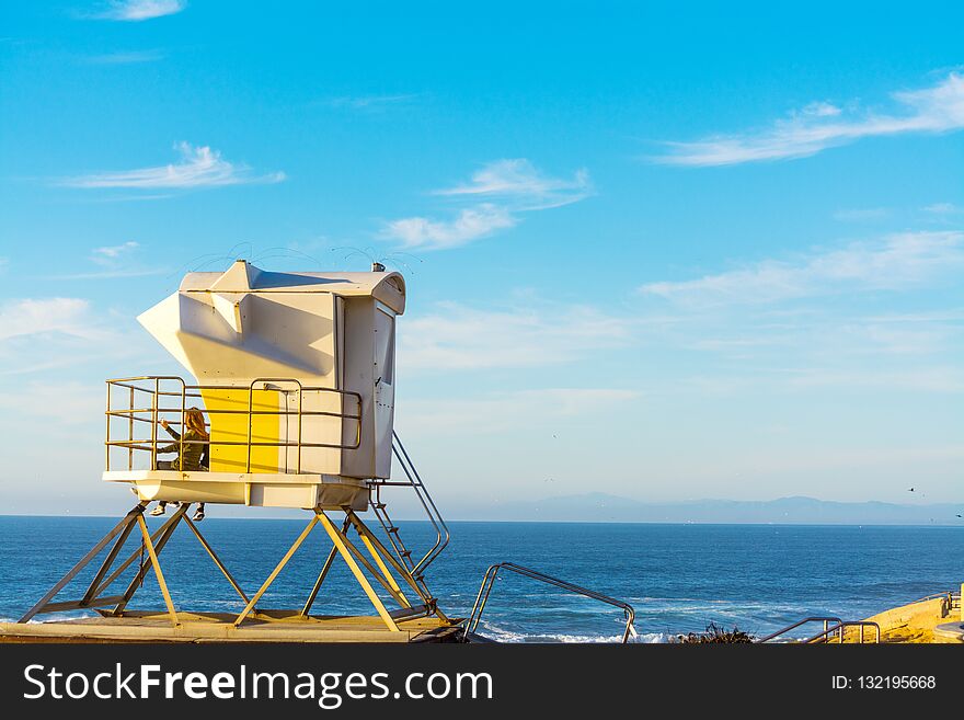 Girls in a lifeguard hut in La Jolla beach, San Diego. Southern California, USA