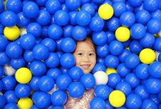 Smiling Little Girl Playing With Color Plastic Balls Playground Stock Image