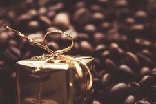 Christmas Gifts On Coffee Beans Background, Selective Focus Royalty Free Stock Photography