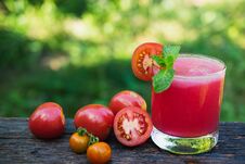 Tomato Juice On Wooden With Tomato Be Side And Mint Leaves On To Royalty Free Stock Images