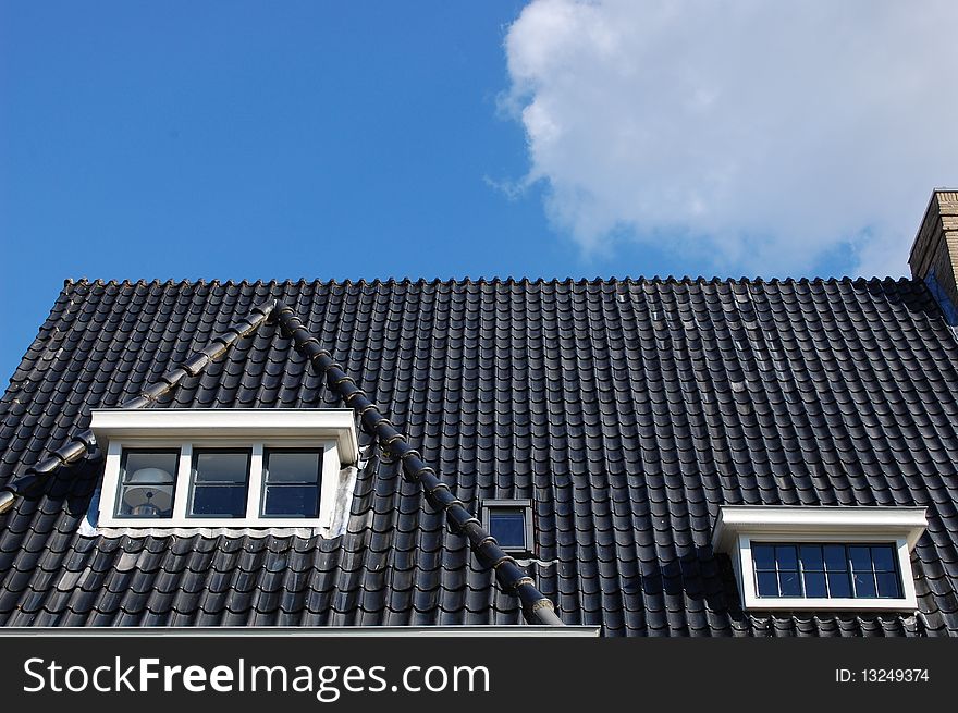 Roof of a house with a blue sky