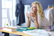 Fashion Designer Woman Working On Her Designs In The Studio. Royalty Free Stock Photo Fashion Designer Woman Working On Her Designs In The Studio. Royalty Free Stock Photo