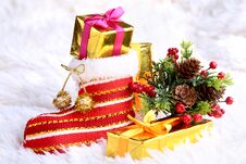 Merry Christmas Composition. Santa`s Shoe With Gift Boxes On Billowy Feathers With Snow And Snowflakes. Happy Holidays. Stock Photos