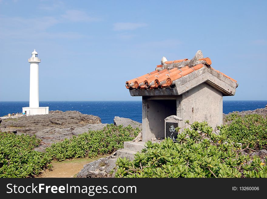 Small Shrine with Light House and Ocean in the Back Ground at Camp Zampa Okinawa Japan