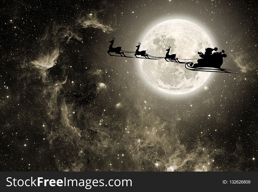 Silhouette of a flying goth santa claus against the background of the night sky. Elements of this image furnished by NASA. Silhouette of a flying goth santa claus against the background of the night sky. Elements of this image furnished by NASA