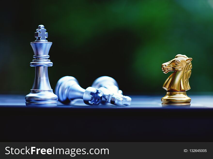 Chess board game, knight winning king, business competitive concept, copy space