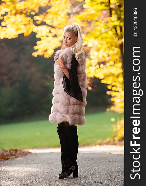 Beautiful Stylish Woman Pose In Park In Early Autumn