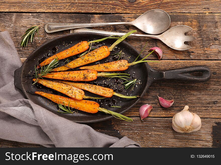 Fried carrot on wood background