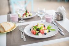 Greek Salad Of Fresh Cucumber, Tomato, Sweet Pepper, Lettuce, Red Onion, Feta Cheese And Olives With Olive Oil Stock Images