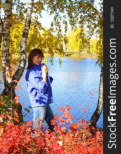 Girl on the background of the autumn landscape. Girl on the background of the autumn landscape