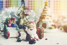 Santa Claus, Snowman, Houses & Snow Sledge Miniature Model Studio Shot On Colorful Background For Family, Giving, Season, Christma Royalty Free Stock Image