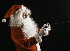 Santa Claus Playing Game Studio Shot On Black Background For Family, Giving, Season, Christmas, Holiday, New Year, Travel, Christi Royalty Free Stock Photo
