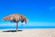 Straw Umbrella On Empty Seaside Beach In Varadero, Cuba. Relaxation, Vacation Idyllic Background Stock Photography