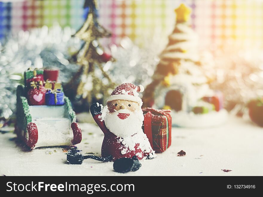 Santa Claus, snowman, houses & snow Sledge miniature model studio shot on colorful background for family, giving, season, Christma