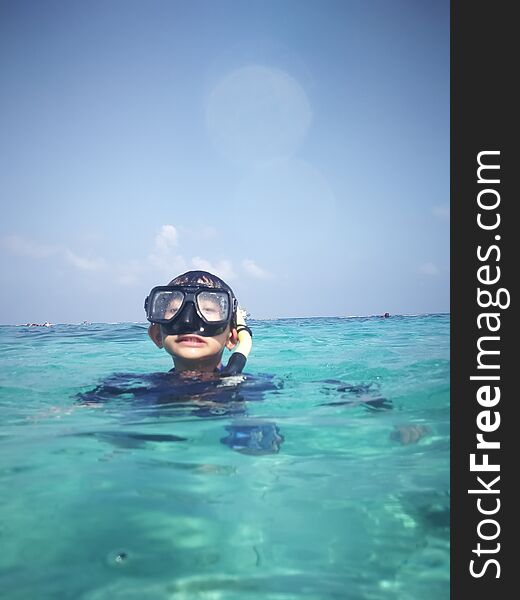 Snorkeling In The Water. Focus On Foreground.