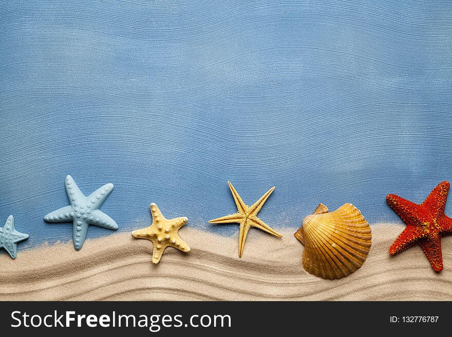 Summertime Background - Beach Sand And Seashells On Blue Table