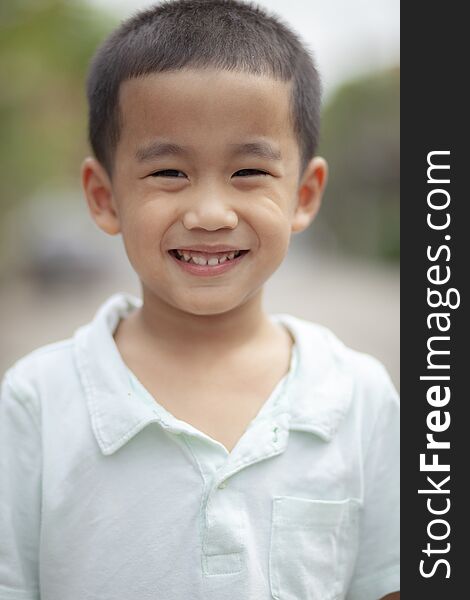 Toothy smiling face of asian children happiness emotion face