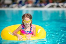 Little Girl With Inflatable Rubber Circle Having Fun In Swimming Pool Stock Images