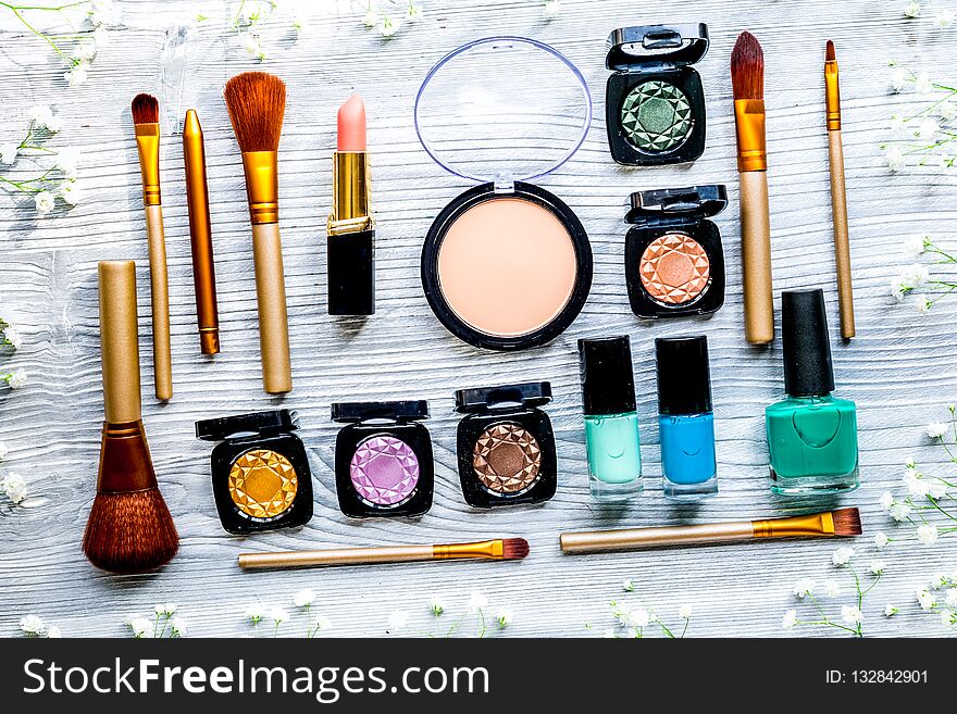 Make up set with decorative cosmetics on woman table background