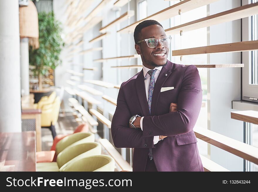 Happy smile of a successful African American businessman in a suit