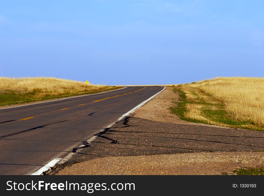 Roadway to a blue sky. Roadway to a blue sky