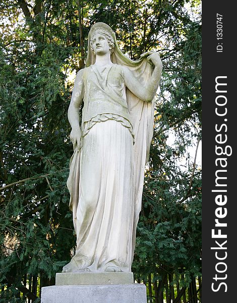 A majestic statue of stone found in a castle grounds in the evening sun. A majestic statue of stone found in a castle grounds in the evening sun.