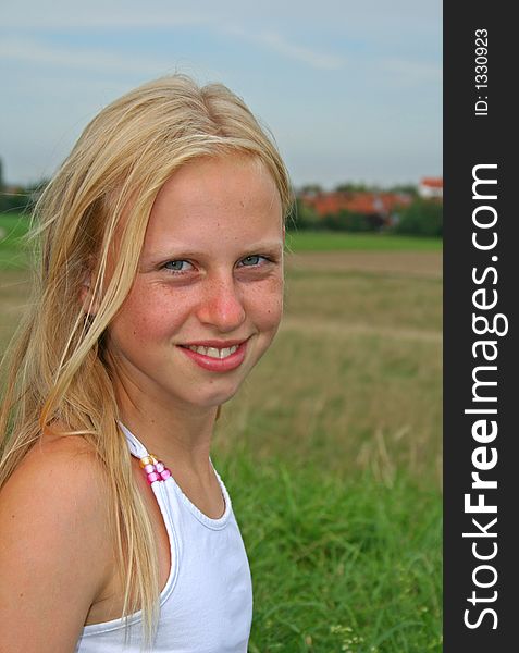 Portrait of standing girl in field