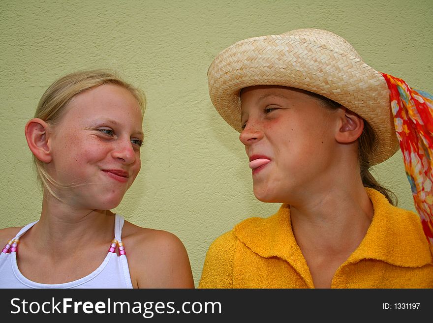 Two young girl friends laughing