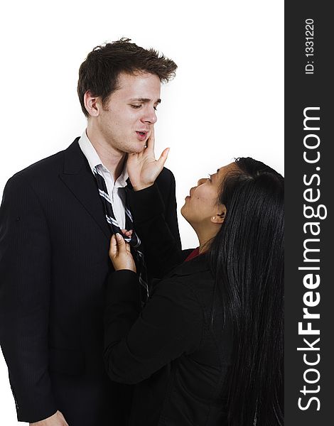 Woman comforting man over white