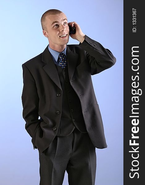 Elegant man, businesman in  a suit talking on a phone