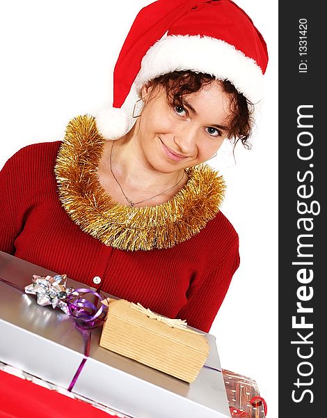 Young woman in a red and white santa fancy hat with presents. Young woman in a red and white santa fancy hat with presents