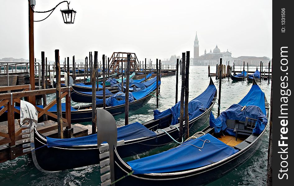 Venice view with gondolas. In the background - monastery  St. Giorgio Maggiore.