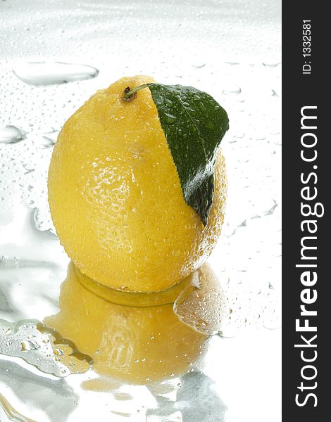 Fresh lemon and drops of water