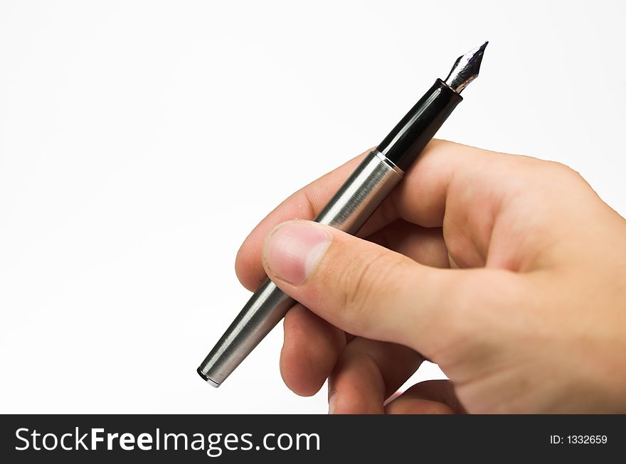 Human hand with silver pen. Human hand with silver pen