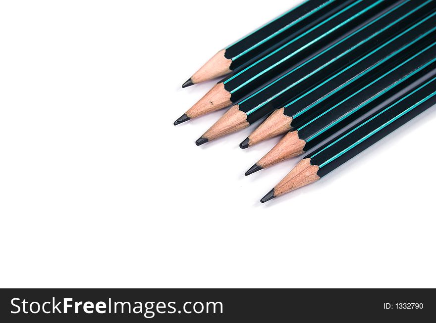 Six pencils on white background