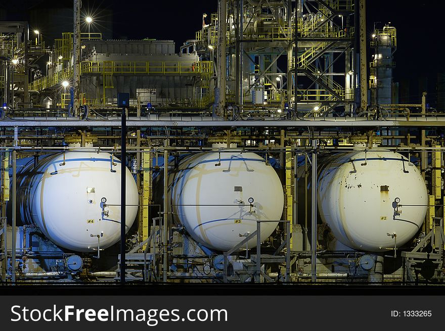 Three oil tanks at night