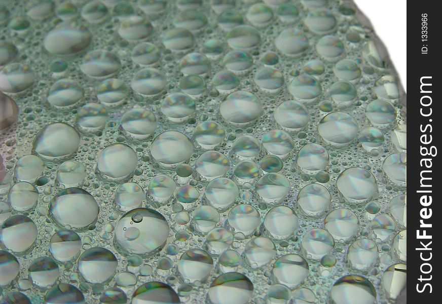 Water drops on a surface of compact disc. Water drops on a surface of compact disc