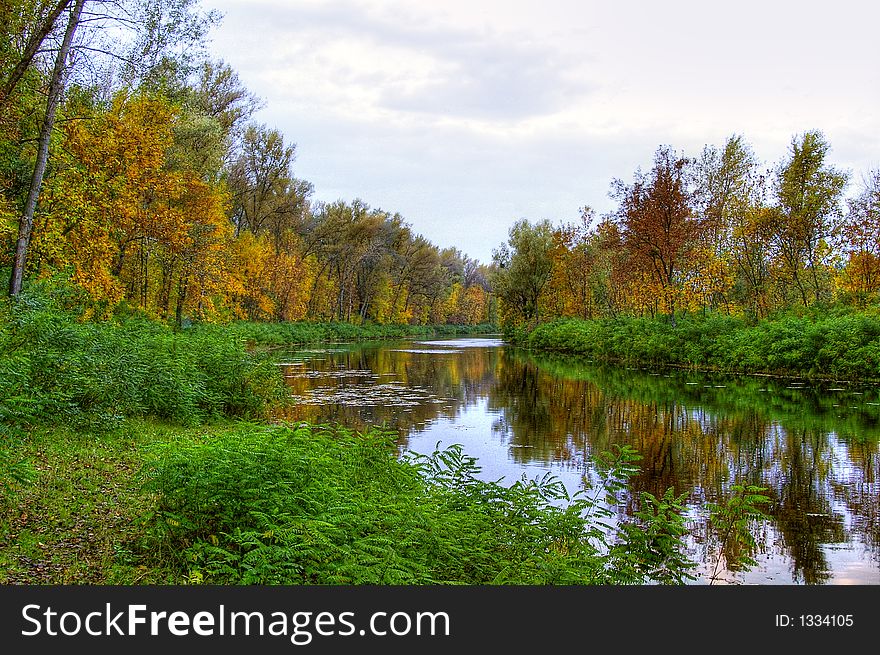 Picturesque autumn landscape of river and bright trees. Picturesque autumn landscape of river and bright trees