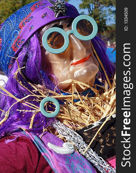 Colorful, fashionable gypsy woman scarecrow. Colorful, fashionable gypsy woman scarecrow