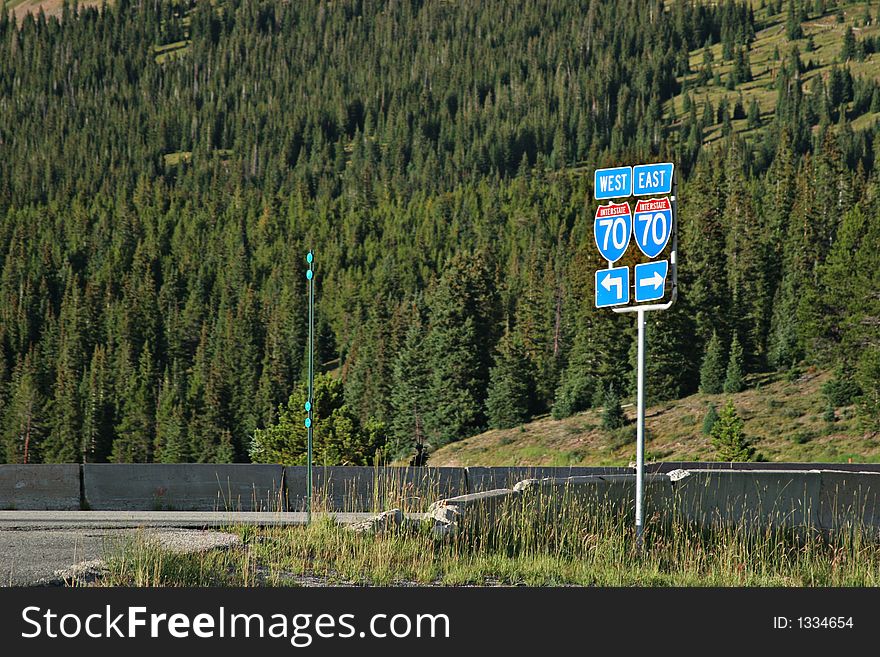 Route 70 road sign with arrows