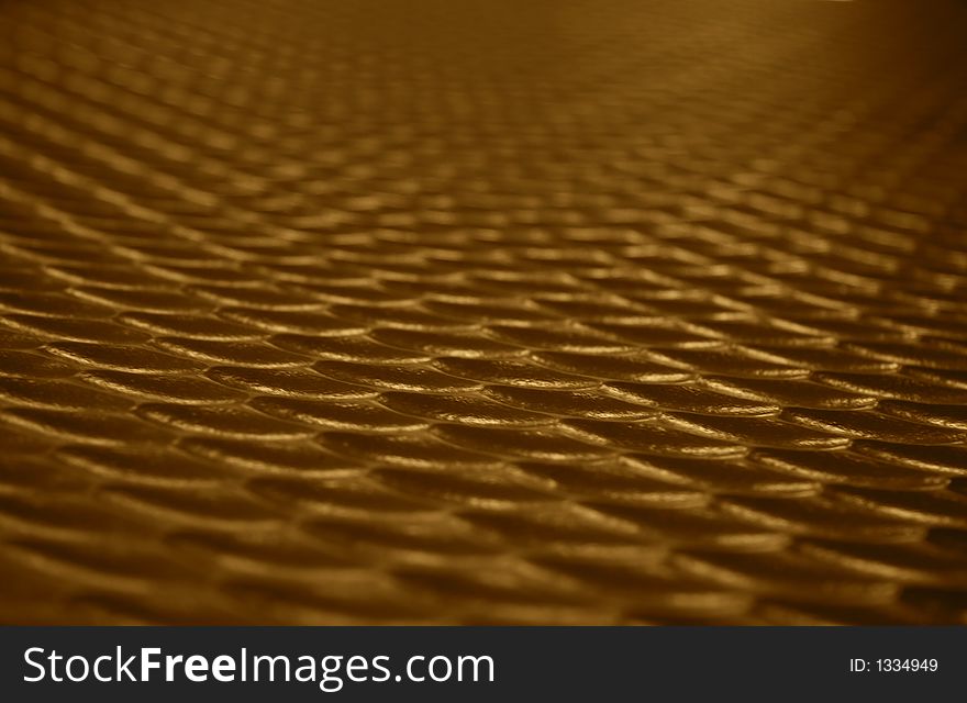 Wave like textured surface with golden colors