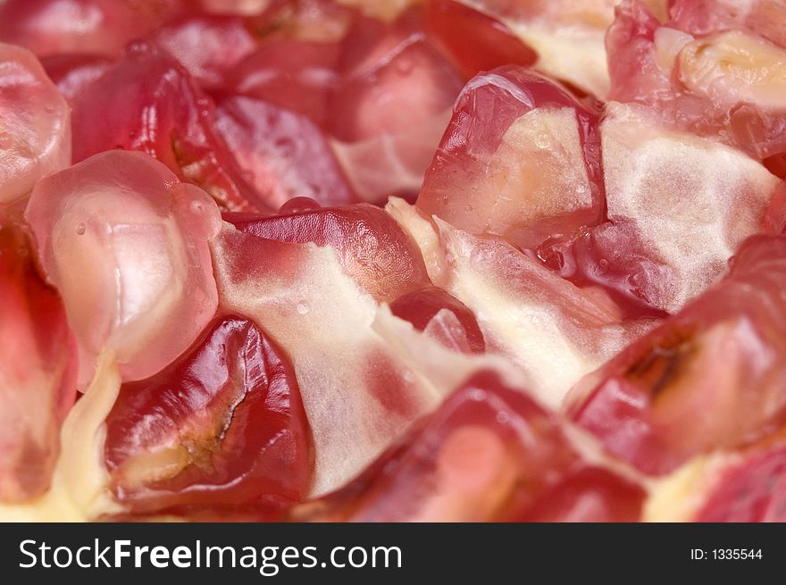 Close up macro shot of pomegranate seeds. One of the superfoods that can lower cholesterol. Close up macro shot of pomegranate seeds. One of the superfoods that can lower cholesterol