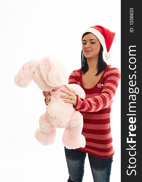 Young beauty girl in sweater  and santa wear with pink rabbi