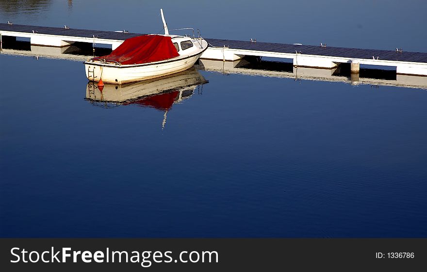 Lake mole with clear blue ad peacefully water and boat